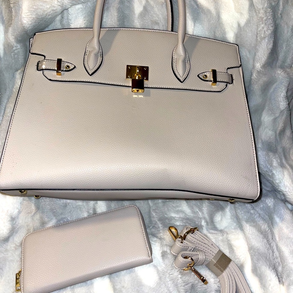 Purse with wallet and strap. New not used just had been stored for a while.